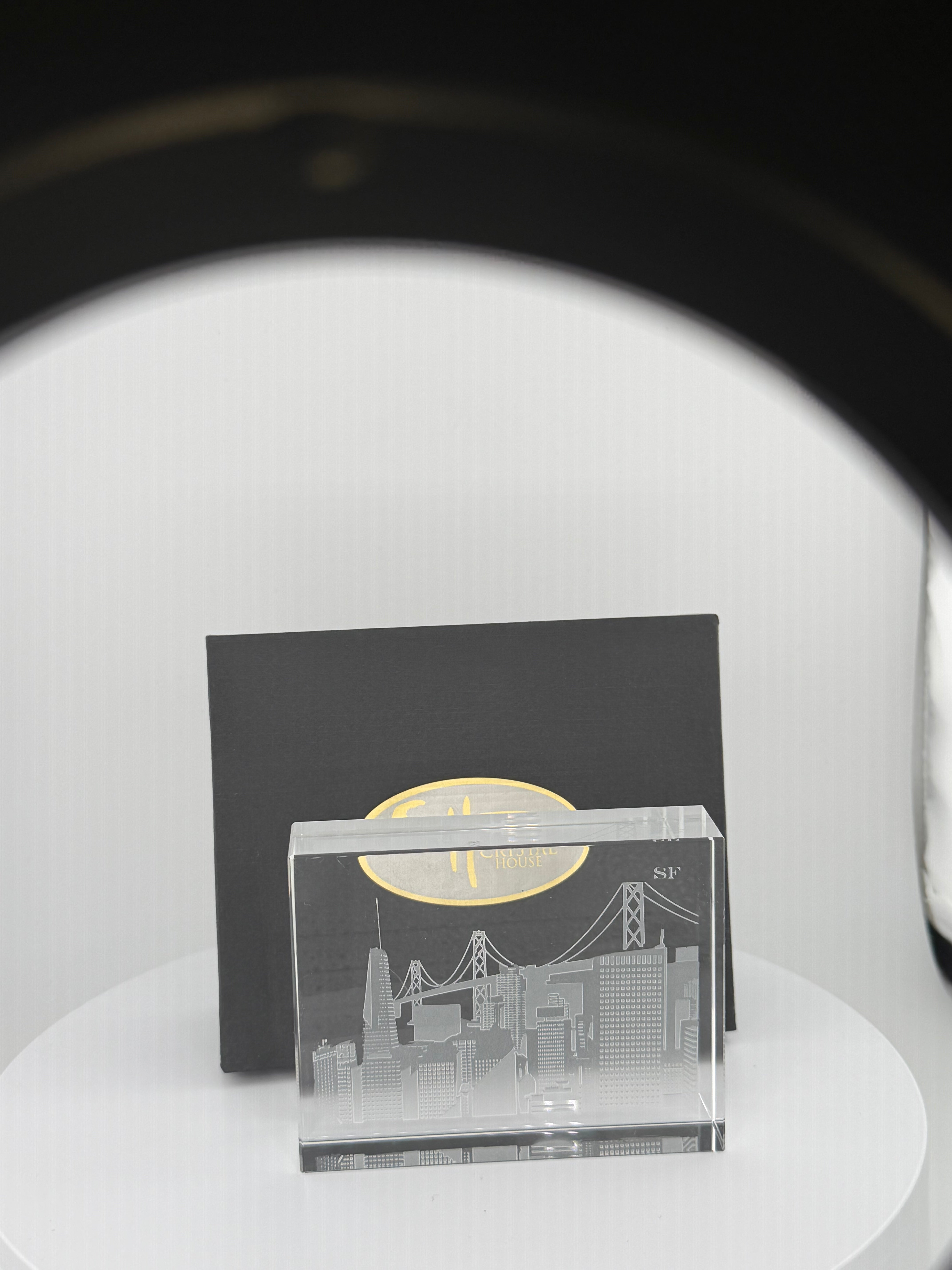“Unique artisan-crafted crystal souvenir showcasing skyline carving.”