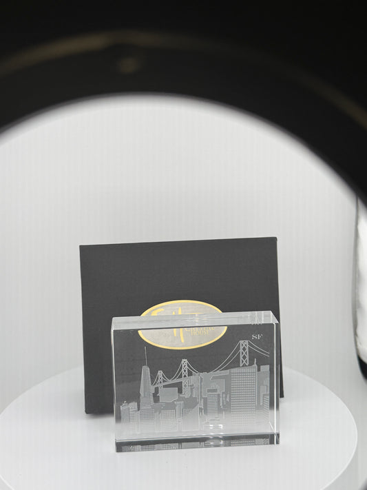 “Unique artisan-crafted crystal souvenir showcasing skyline carving.”