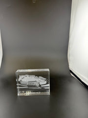 Sand-carved crystal paperweight featuring intricate city skyline engraving by Crystal House artisans