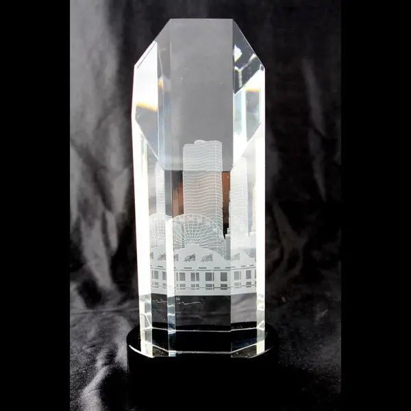 Custom engraved faceted crystal obelisk award for Chamber of Commerce recognition."