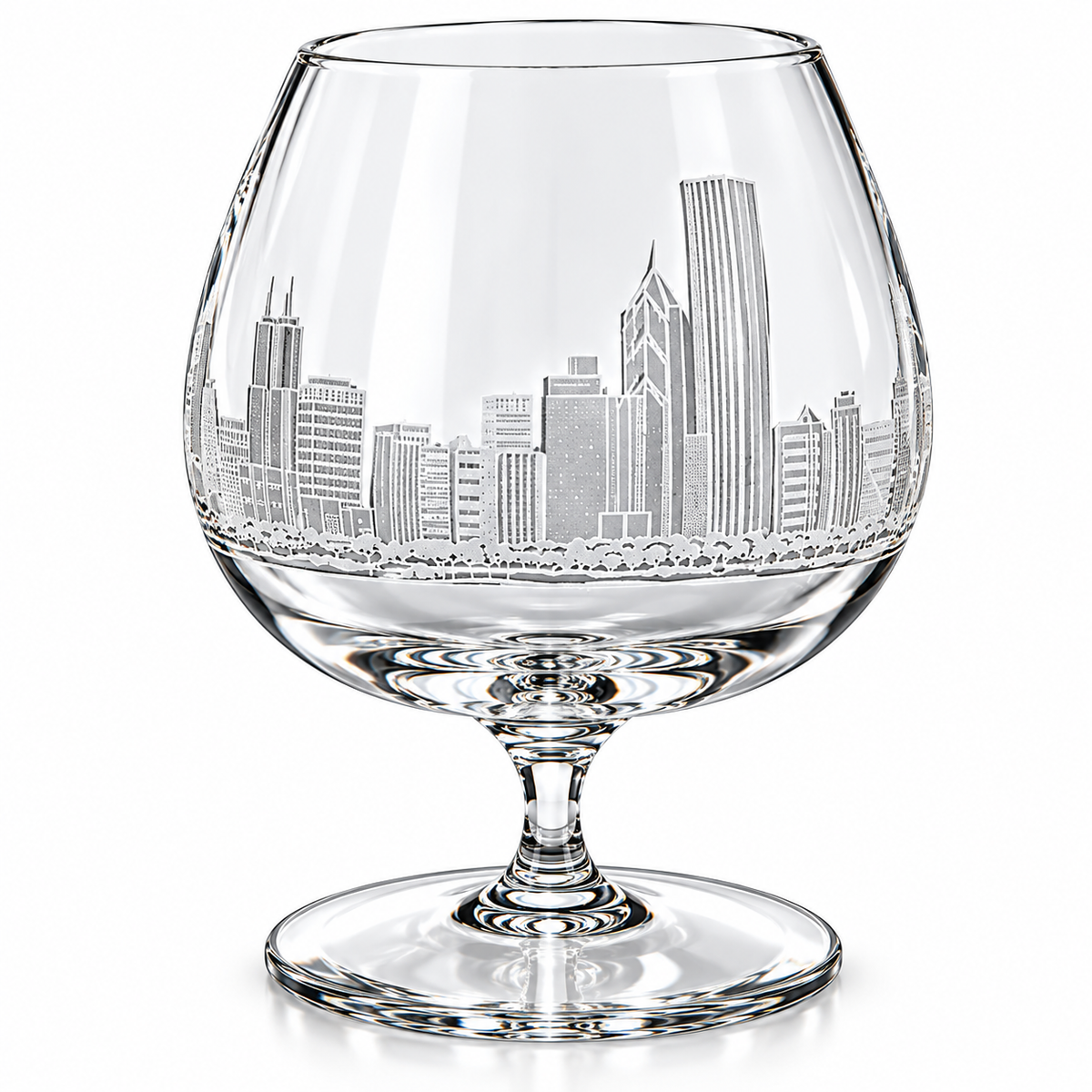Clear crystal cognac glass with an etched Philadelphia skyline design on the bowl, set against a plain white background.