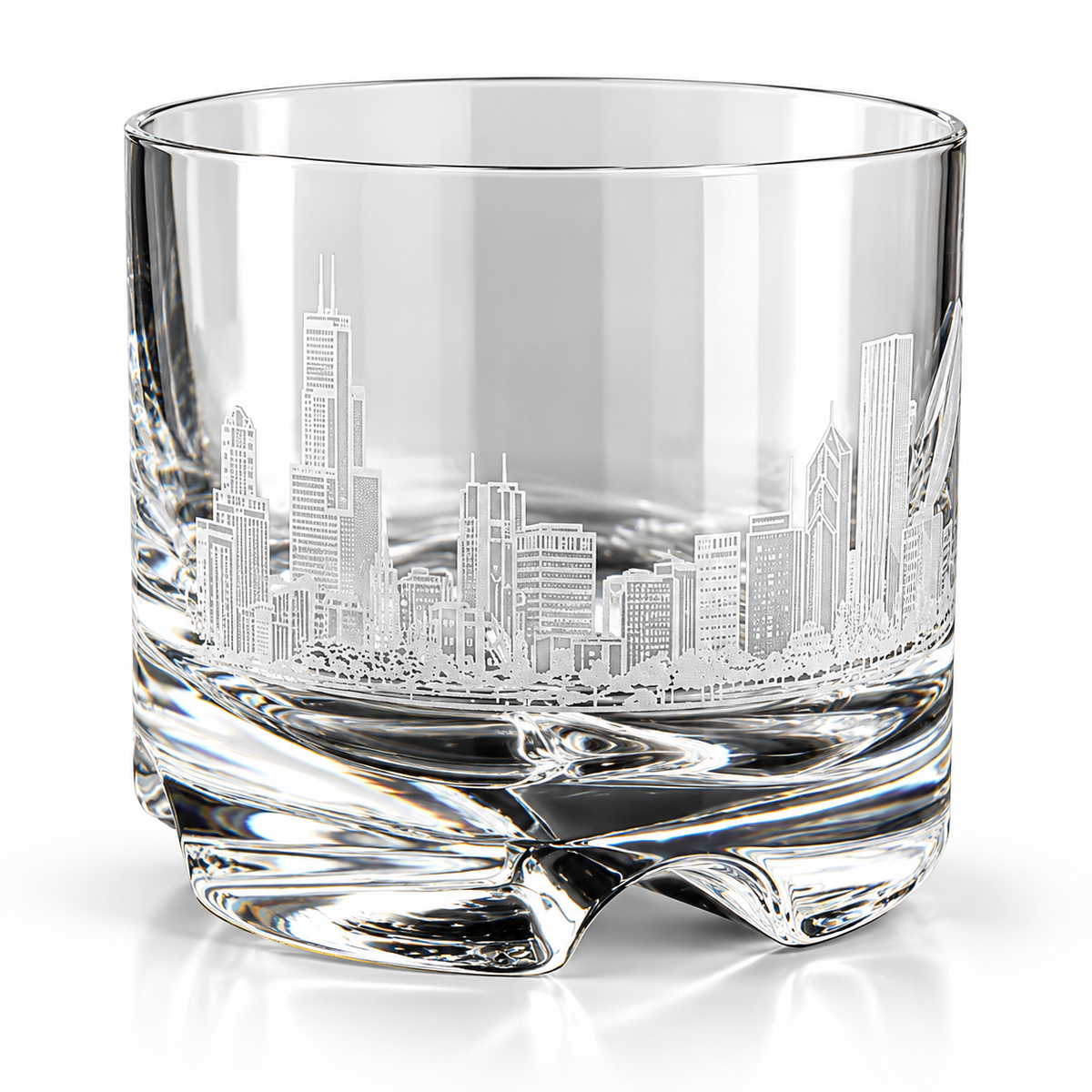 A clear glass rocks tumbler featuring an etched Chicago skyline design on the front, set against a clean white background.