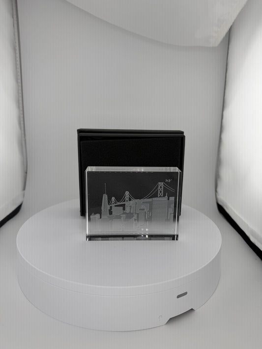Master-crafted Crystal House paperweight with detailed sand-carved city silhouette