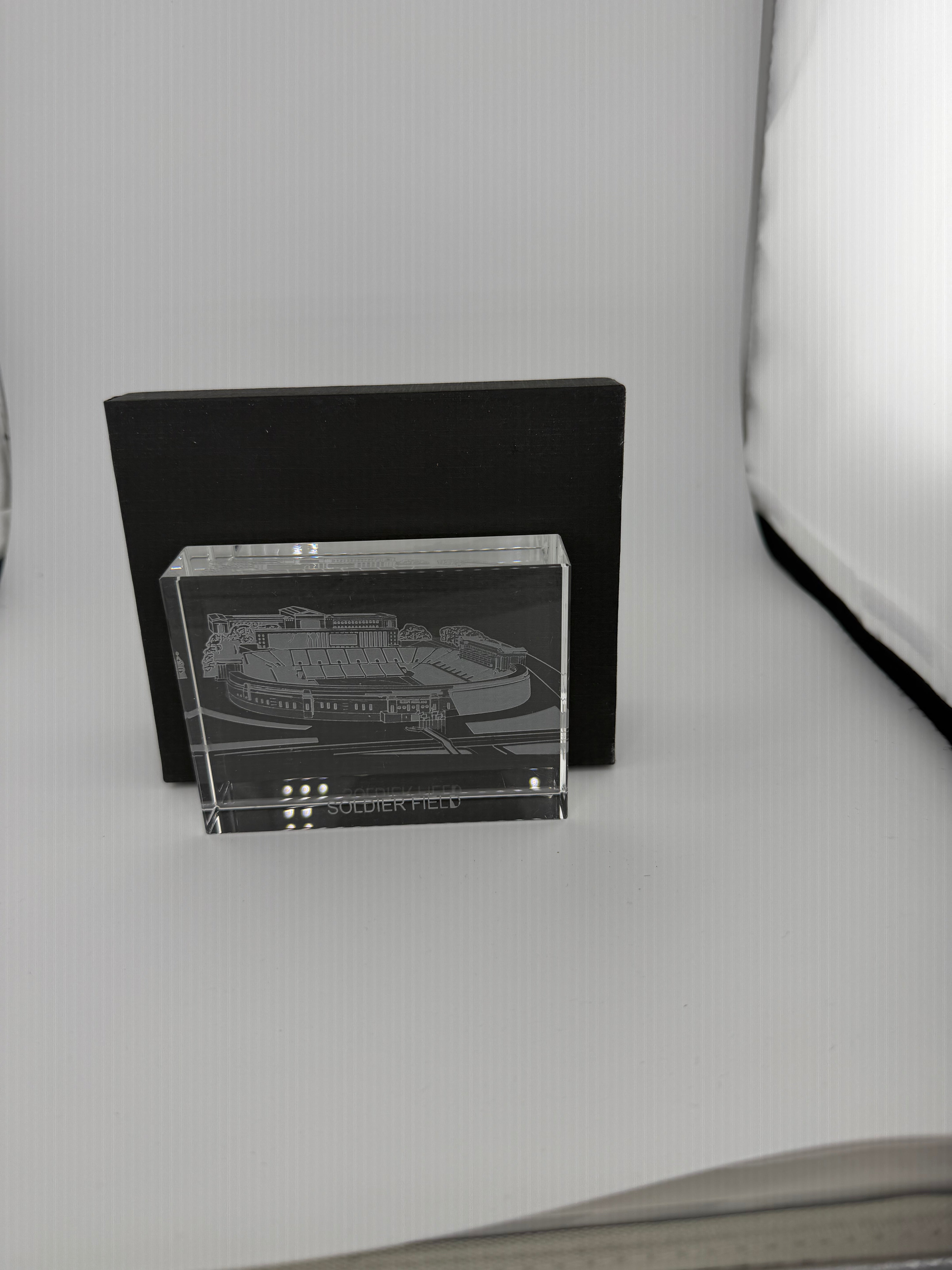 Close-up of deep hand-carved skyline details on premium crystal paperweight