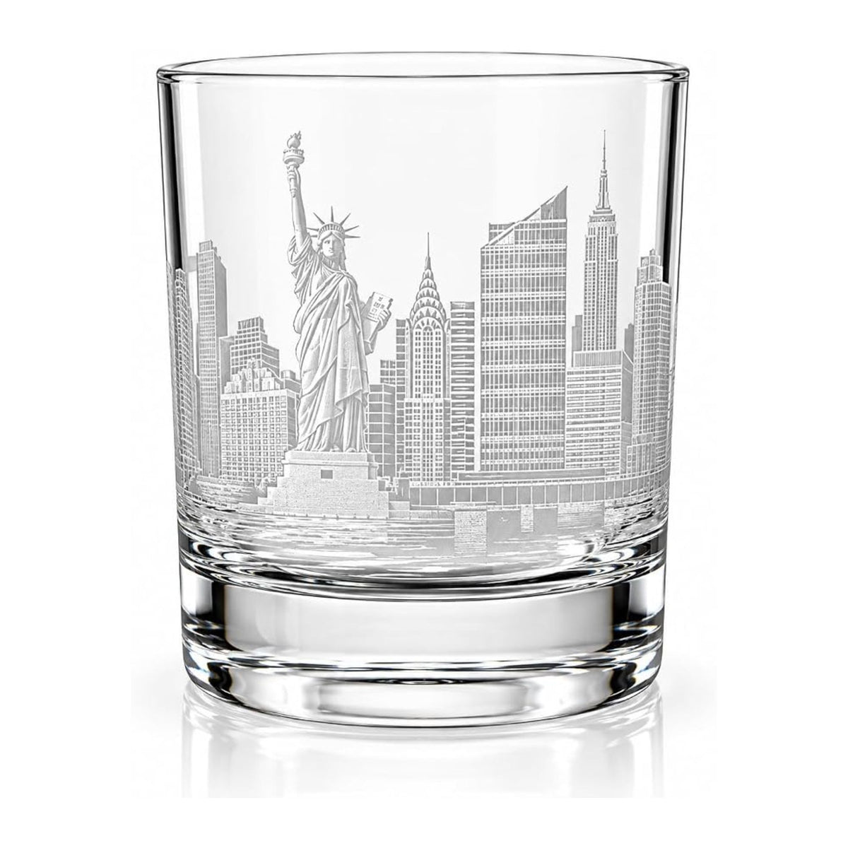 A clear glass rocks tumbler featuring an etched New York City skyline design with the Statue of Liberty and skyscrapers, shown on a white background with a soft reflection.