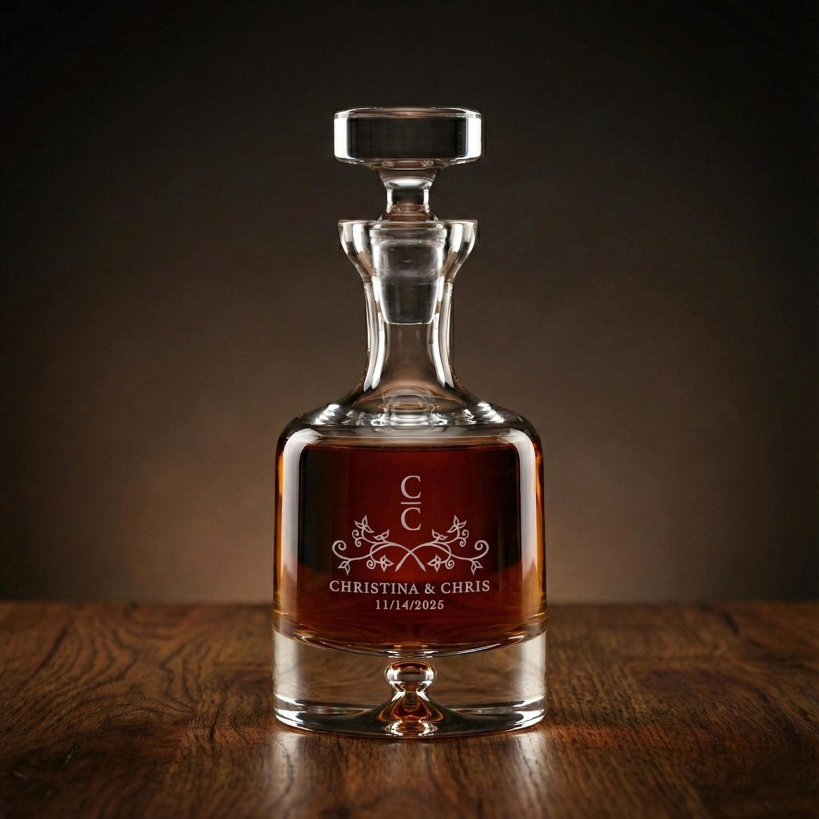 A crystal decanter deep-carved with a monogram, Christina and Chris, and their wedding date